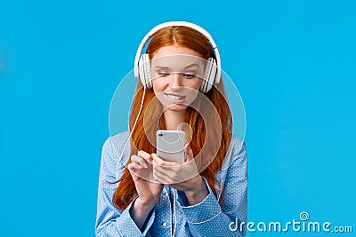 Waist-up portrait indecisive, unsure picky cute redhead female in nightwear, biting lip and looking tempting with desire Stock Photo