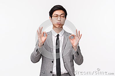 Waist-up portrait of smart successful, handsome asian man rate perfection, see exquisit fabulous concept, showing okay Stock Photo