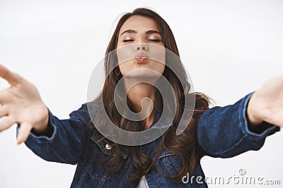 Waist-up portrait tender and romantic, feminine brunette female reaching hands, want hold someone tight, embrace in her Stock Photo