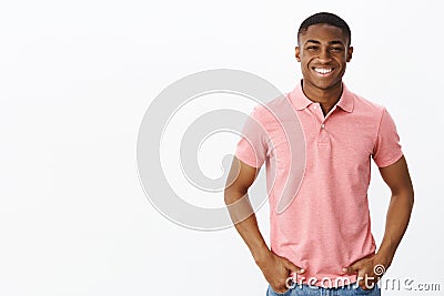 Waist-up shot of attractive positive and happy young african american male entrepreneur in pink polo shirt holding hands Stock Photo