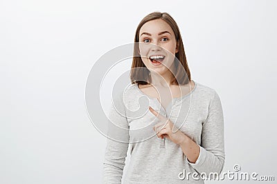 Waist-up shot of enthusiastic energized cute girl reacting to awesome offer of friend going sit in cafe smiling joyfully Stock Photo