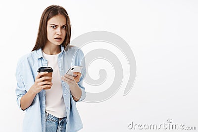 Waist what you make me worry. Disturbed stunned and nervous trendy busy woman holding paper cup with coffee and Stock Photo