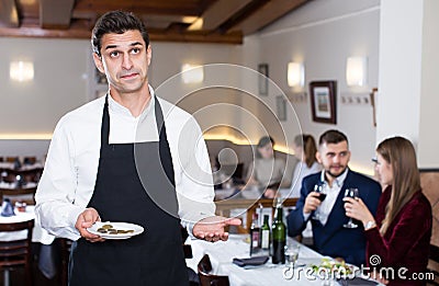 Waiter dissatisfied with small tip Stock Photo