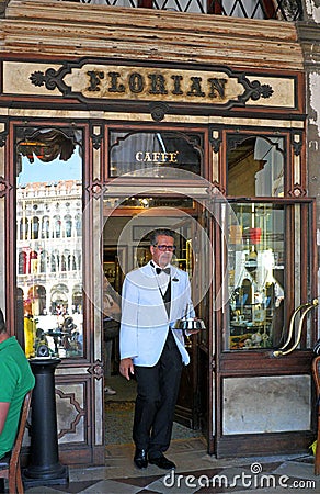 A waiter at f the iconic Florian cafe in Saint Mark's Square, Venice, Italy Editorial Stock Photo