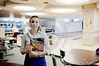 Waiter girl holding menu at cafe. People and service concept Stock Photo