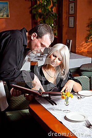 The waiter helped visitor Stock Photo