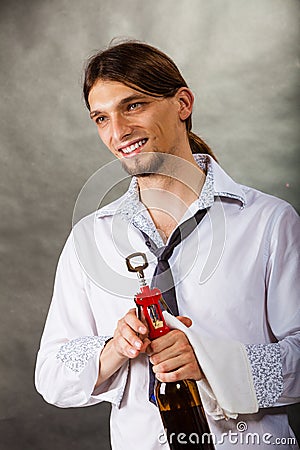 Waiter opens wine bottle. Stock Photo