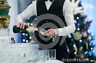Waiter pouring glasses of champagne Stock Photo