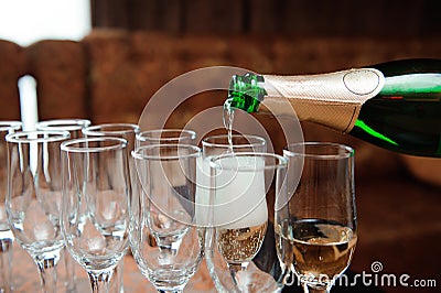 Waiter pours champagne in glasses, luxury event. Stock Photo