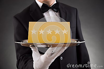 Waiter Serving Star Rating Stock Photo