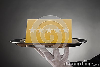 Waiter Serving Star Rating Stock Photo