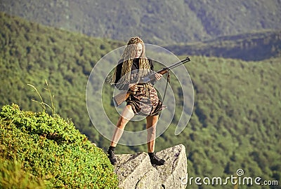 Waiting for Prey. woman assassin with gun. war time. female soldier. army sniper. weapon shop concept. gender equality Stock Photo