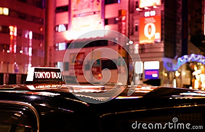 A waiting Tokyo taxi on a summer night in the metropolis. Stock Photo