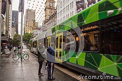 Waiting for tram in Bourke St., Melbourne Editorial Stock Photo