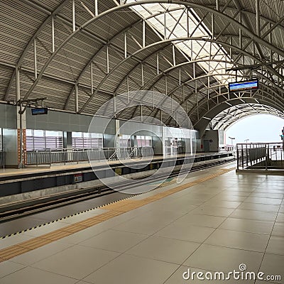 waiting at very busy electric train station Stock Photo