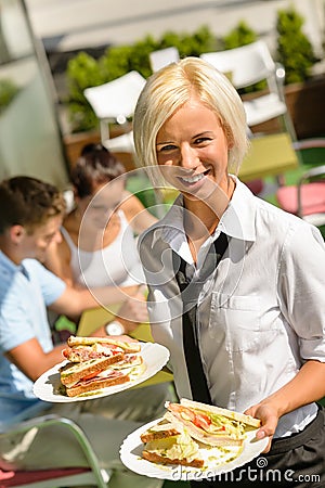 Waitress bringing sandwiches on plates fresh lunch Stock Photo