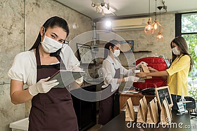 Waitress with face mask take order for curbside pick up and takeout Stock Photo