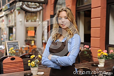 Waitress in front of restaurant Stock Photo