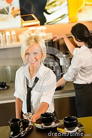 Waitress serving coffee cups making espresso woman Stock Photo