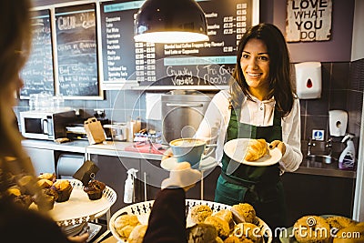 Waitress serving a cup of coffee Stock Photo