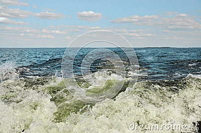 Wake wave behind motor boat Stock Photo