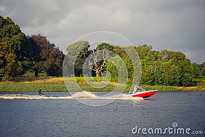 Wake-boarding on a lake behind a boat Editorial Stock Photo