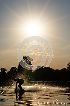 Wakeboarder silhouette against the sunset Stock Photo