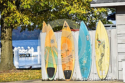 Wakeboards Along Fence by Lake Editorial Stock Photo