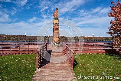 Wakefield, Michigan - October 18, 2019: Trail of the Whispering Giants totem pole statue on Lake Superior by artist Peter Wolf Editorial Stock Photo