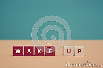 Waking up. Awakening. Good morning. Beginning new day. Wake up inscription on colorful wooden cubes. Place for text Stock Photo