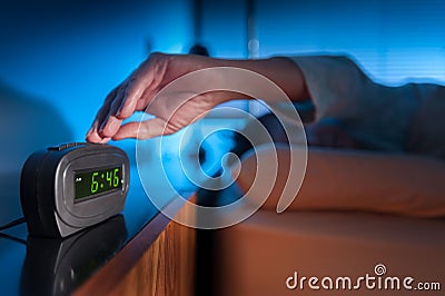 Waking up to an alarm clock Stock Photo