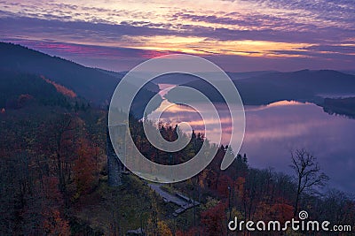 Waldenburg castle ruins and the Biggesee at sunset from a bird's eye view Stock Photo