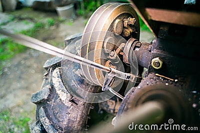 Walk-behind tractor pulley with two belts close-up. Tractor for agriculture, agricultural machinery Stock Photo