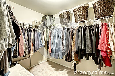 Walk-in closet with clothes Stock Photo