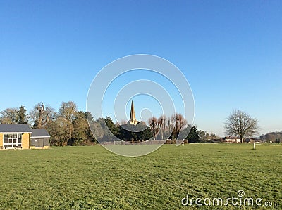 Walk through the countryside passing sheep and church steeples Stock Photo