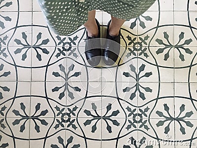 Walk on vintage patterned tiles Stock Photo