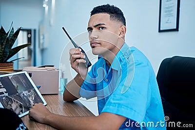 Walkie talkie, security guard and man at table in communication, surveillance and thinking. Safety, protection and Stock Photo