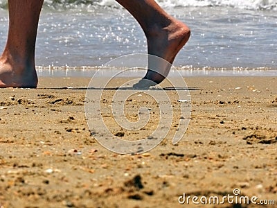 Walking along the beach Stock Photo