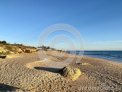 Walking along the sandy beach of Praia Da Gale in Algarve, south of Portugal Stock Photo
