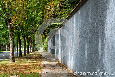 Walking along the walls of champagne house in old French city Reims in August, France Stock Photo
