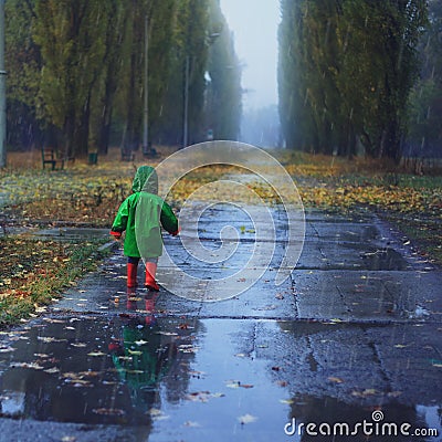 Walking in autumn rainy park Stock Photo