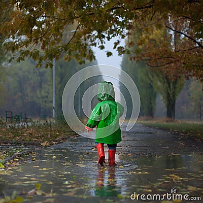 Walking in autumn rainy park Stock Photo