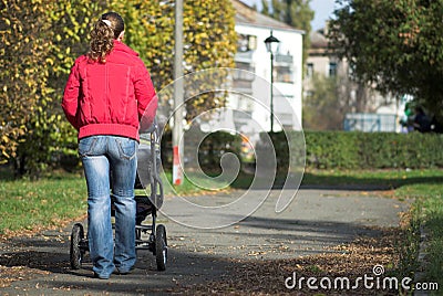 Walking with baby carriage Stock Photo