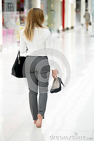 Walking barefoot in office style clothes Stock Photo