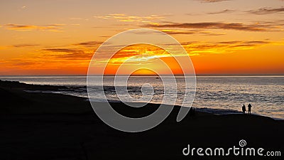 Walking the beach the during the Desert sunrise of Cabo San Lucas Mexico Stock Photo
