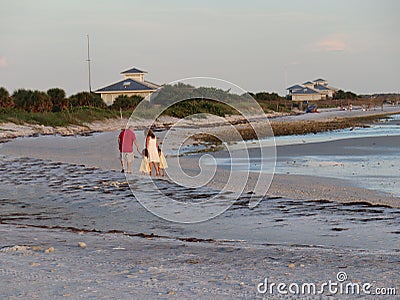 A family walking on the beach Editorial Stock Photo