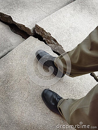 Walking on Broken Dangerous Sidewalk Stock Photo