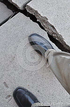 Walking on Broken Dangerous Sidewalk Stock Photo