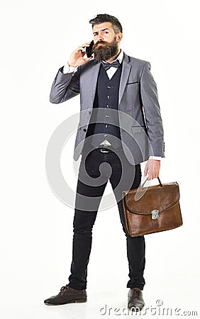 Walking business man with briefcase on white background Stock Photo