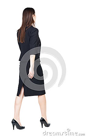 Walking business woman. back view. Stock Photo